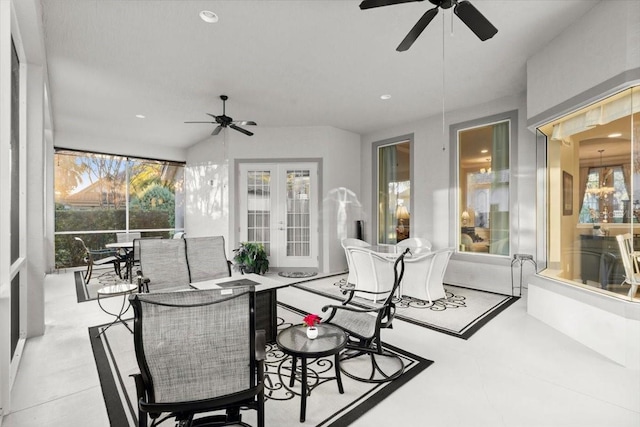 sunroom / solarium featuring ceiling fan and french doors