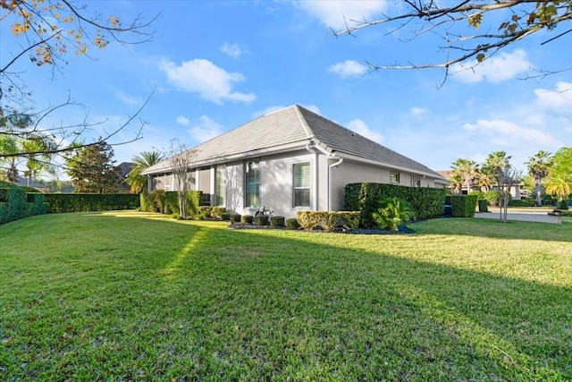 view of home's exterior with a yard