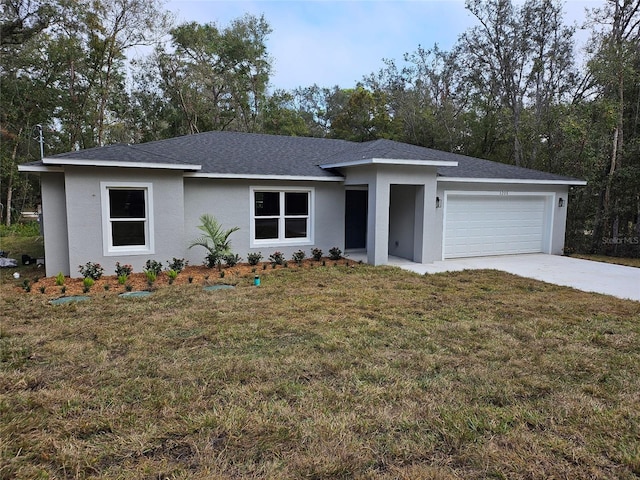 view of front of house featuring a garage and a front lawn