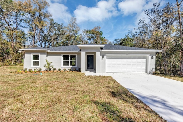 view of front of home with a garage, concrete driveway, a front yard, and stucco siding