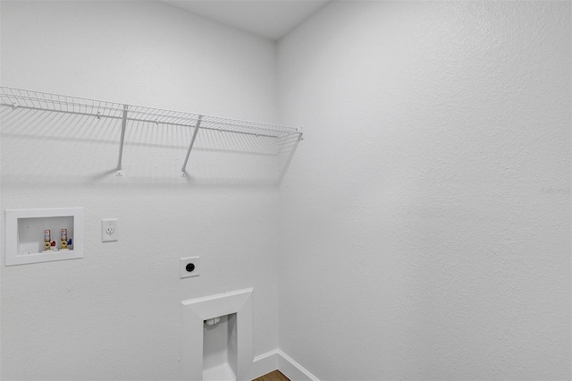 clothes washing area with laundry area, hookup for a washing machine, baseboards, and electric dryer hookup