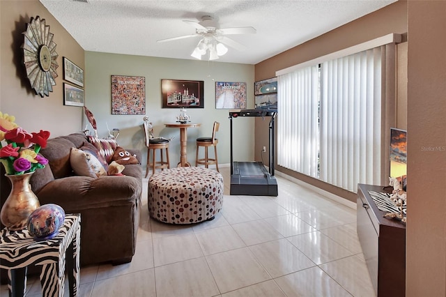 interior space featuring a textured ceiling and ceiling fan