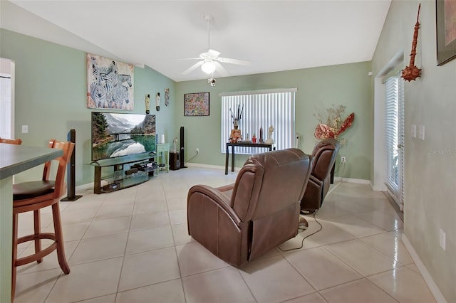 living room with ceiling fan and light tile patterned floors