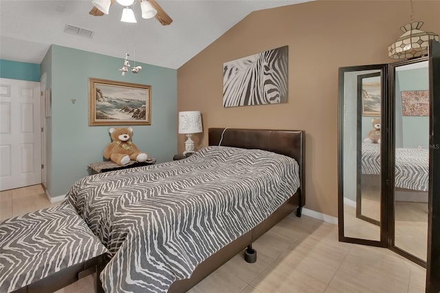 bedroom featuring light tile patterned floors, vaulted ceiling, and ceiling fan