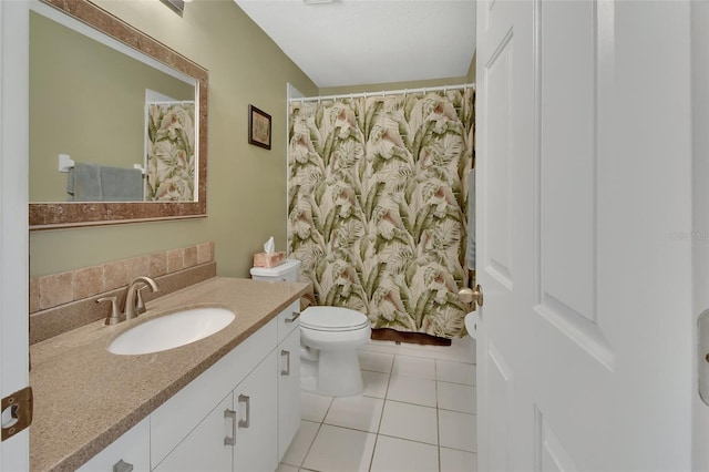 bathroom featuring tile patterned flooring, vanity, curtained shower, and toilet