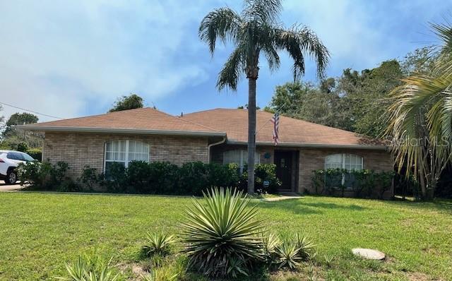 2994 Annez Way, Debary, FL 32713 - ranch-style home with a front yard and brick siding