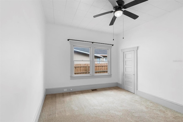 carpeted empty room with ceiling fan