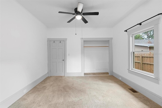 unfurnished bedroom featuring ceiling fan and carpet floors