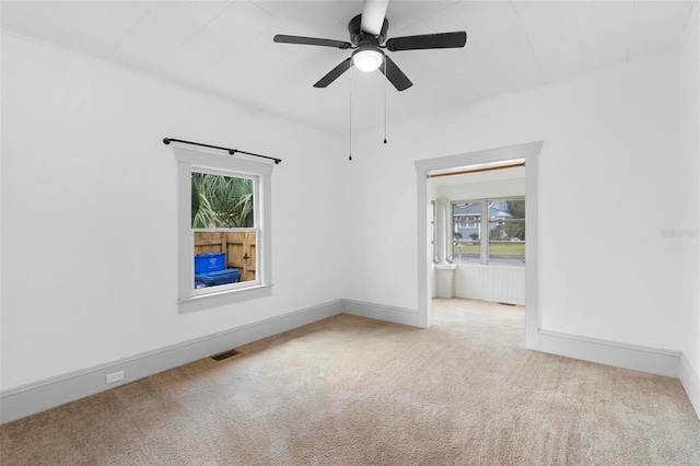 carpeted empty room with ceiling fan