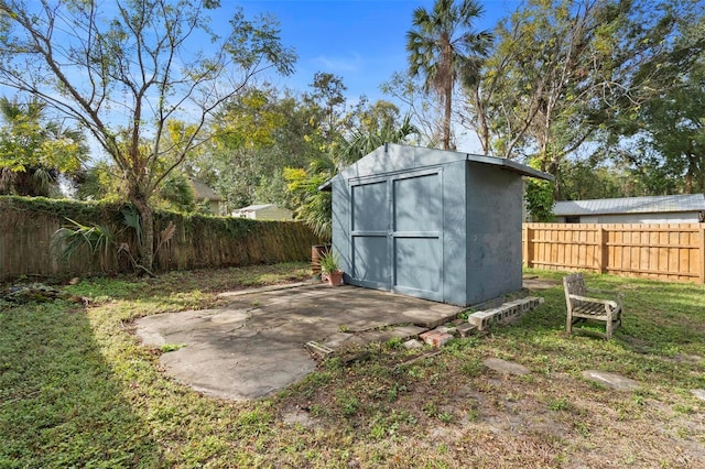 view of outdoor structure featuring a lawn