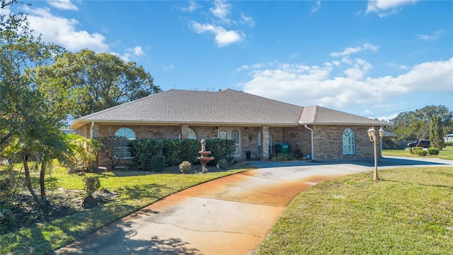 ranch-style home with a front lawn