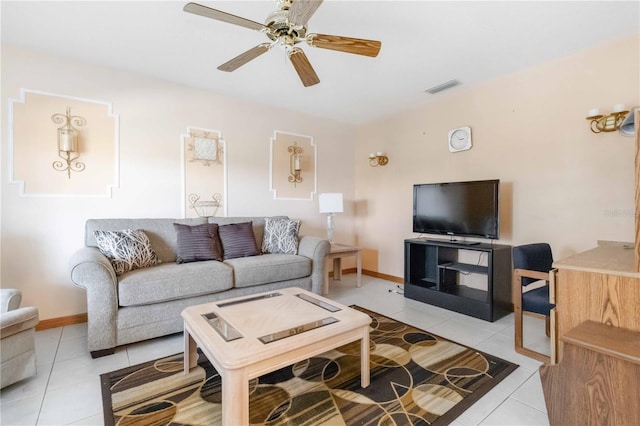 living room with light tile patterned floors and ceiling fan