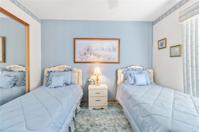 bedroom with ceiling fan and light colored carpet