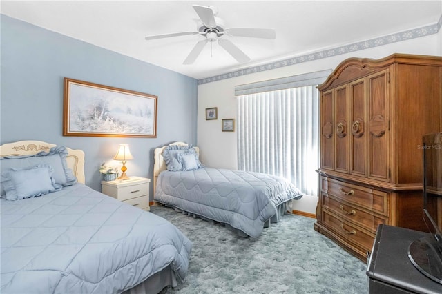 bedroom featuring light colored carpet and ceiling fan