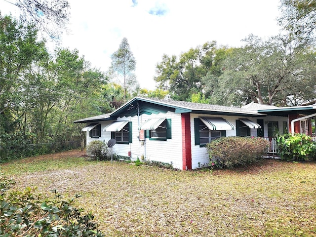 view of home's exterior featuring a yard