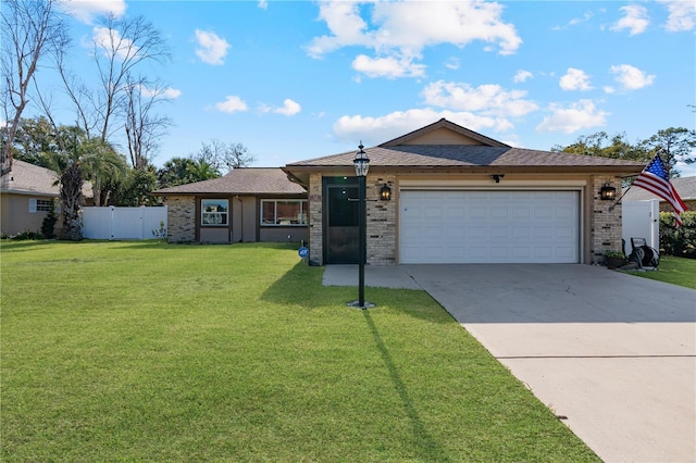 ranch-style home featuring a garage and a front yard