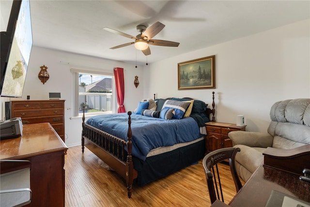 bedroom with ceiling fan and light hardwood / wood-style flooring