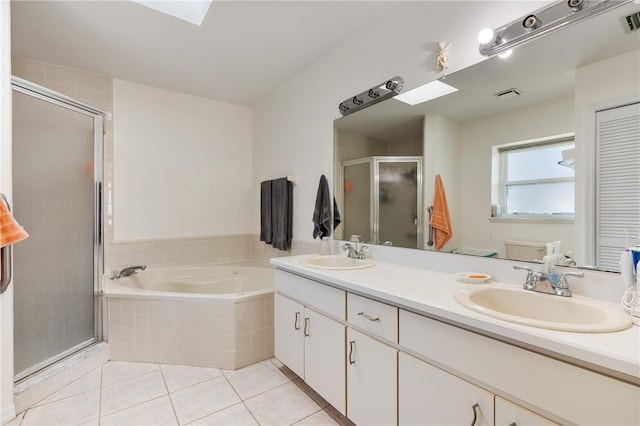 bathroom with tile patterned floors, vanity, and plus walk in shower