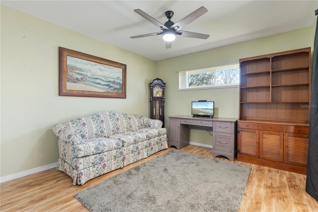 home office featuring light hardwood / wood-style floors and ceiling fan