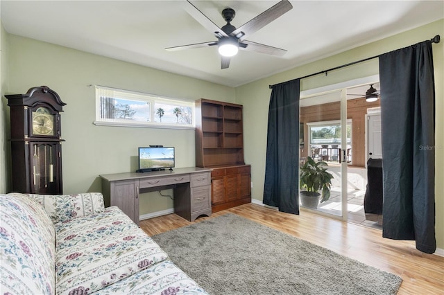 office area with light wood-type flooring and ceiling fan