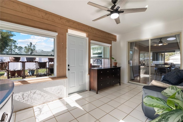 interior space with wooden walls and light tile patterned floors