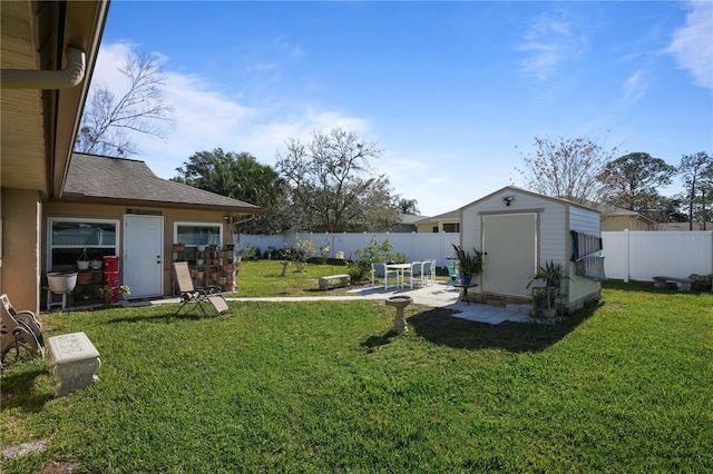 view of yard featuring a patio area and a storage shed