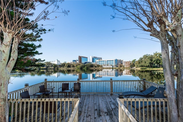 dock area with a deck with water view