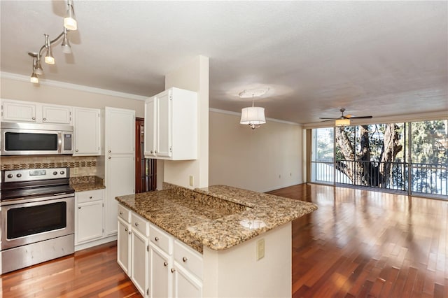 kitchen with ceiling fan, light stone countertops, hanging light fixtures, white cabinets, and appliances with stainless steel finishes