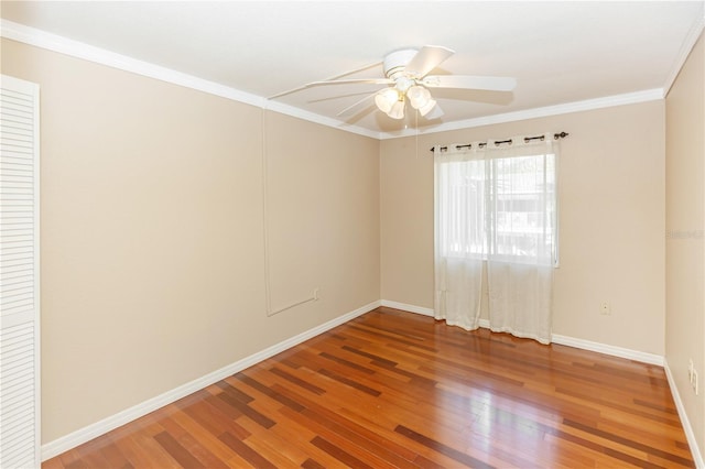 spare room with crown molding, hardwood / wood-style floors, and ceiling fan