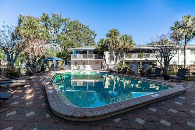 view of pool with a gazebo and a patio