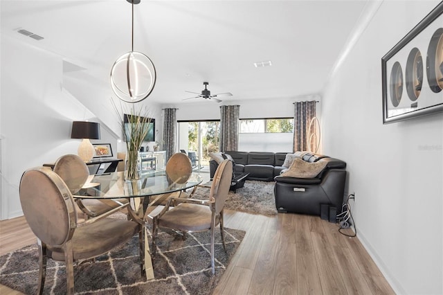 dining room with hardwood / wood-style floors and ceiling fan