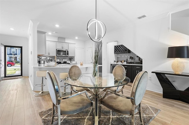 dining room featuring light hardwood / wood-style flooring