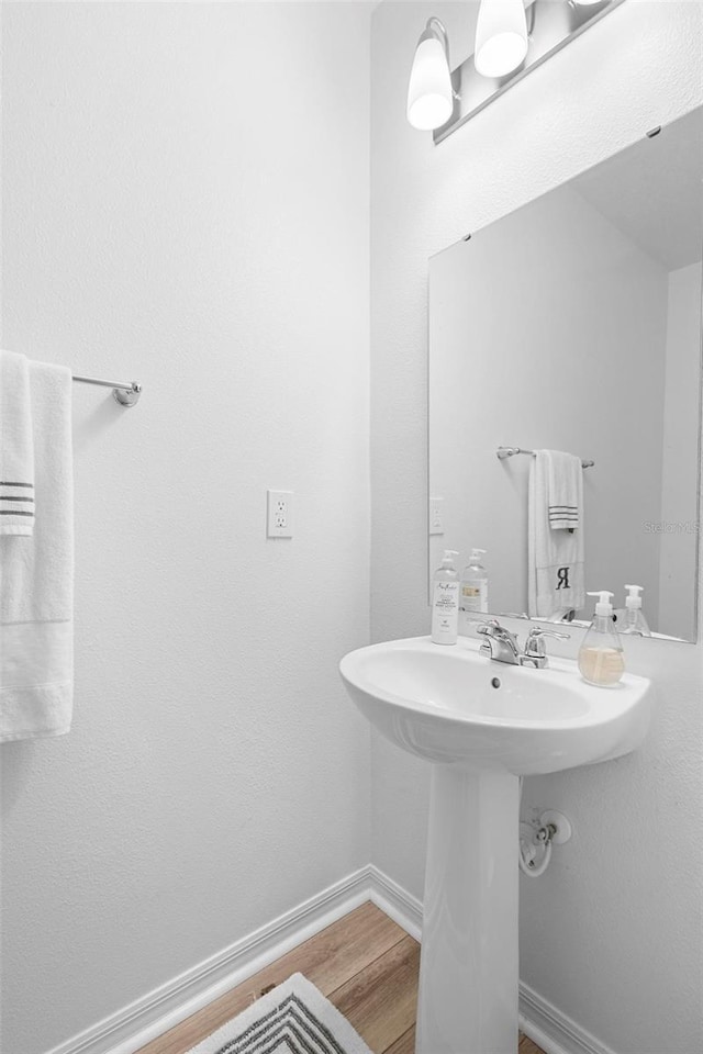 bathroom featuring hardwood / wood-style flooring and sink