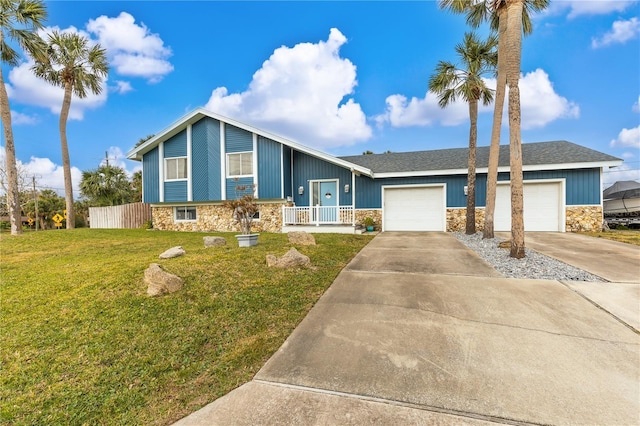 view of front of home featuring a garage and a front lawn