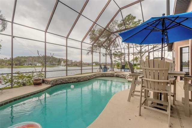 view of swimming pool with a patio, a water view, and a lanai