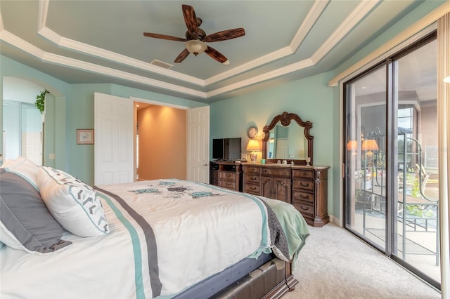 bedroom featuring access to outside, a raised ceiling, ceiling fan, ornamental molding, and light colored carpet