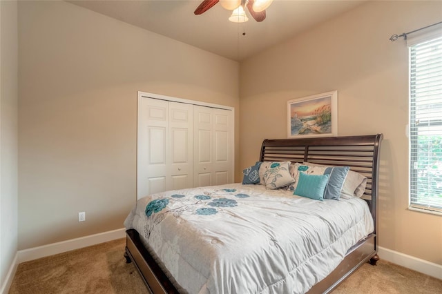 bedroom featuring ceiling fan, carpet floors, and a closet