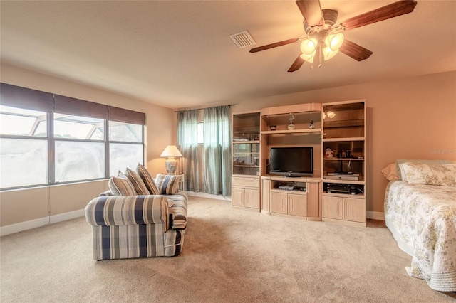 living room with ceiling fan and light colored carpet