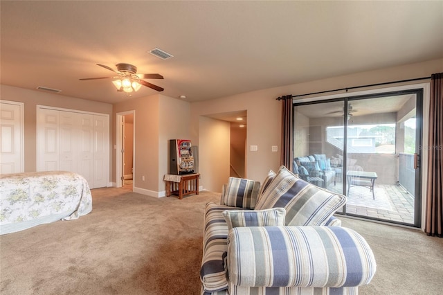 living room with light colored carpet and ceiling fan