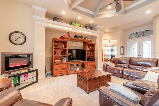 living room with light carpet, french doors, crown molding, beamed ceiling, and a high ceiling