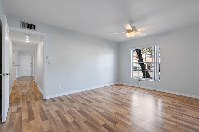 unfurnished room featuring ceiling fan and light hardwood / wood-style flooring