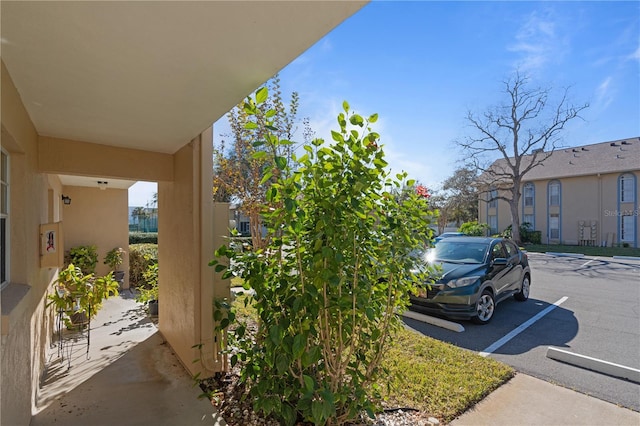 exterior space with a carport