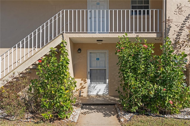 entrance to property featuring a balcony