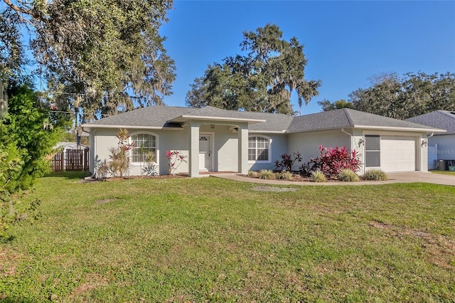 ranch-style home with a front yard and a garage