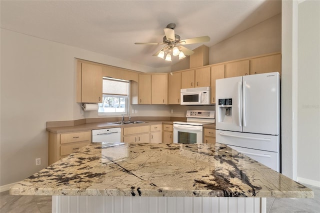 kitchen with light brown cabinets, white appliances, sink, vaulted ceiling, and ceiling fan