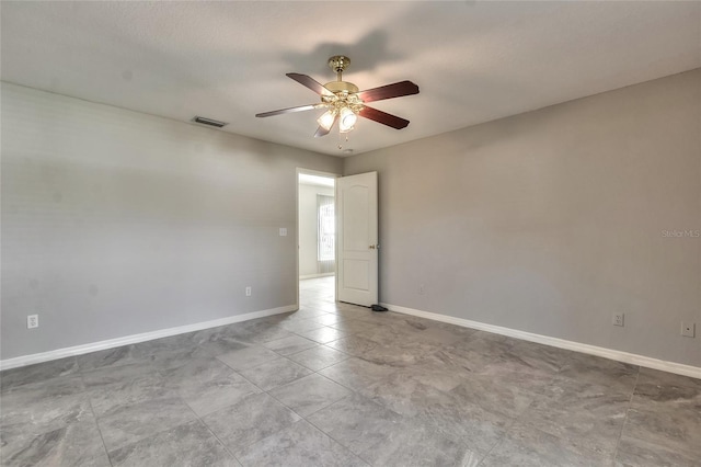 spare room with ceiling fan