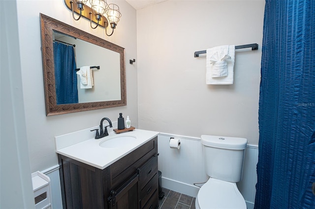 full bathroom featuring wood finished floors, vanity, and toilet