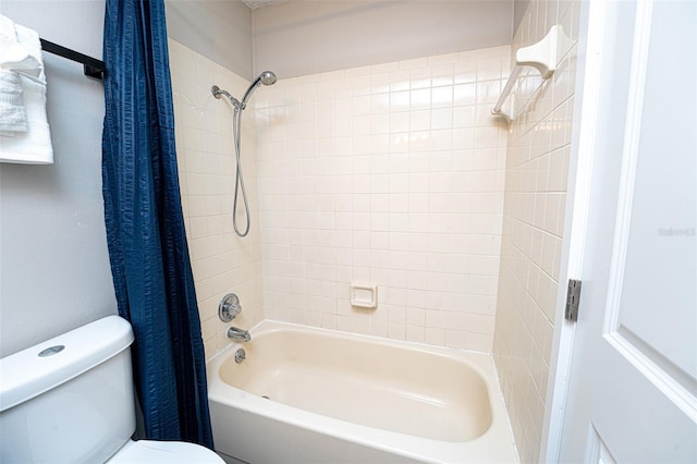 bathroom with shower / bath combination with curtain and toilet