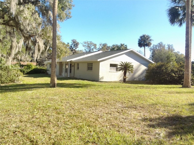 exterior space with a lawn