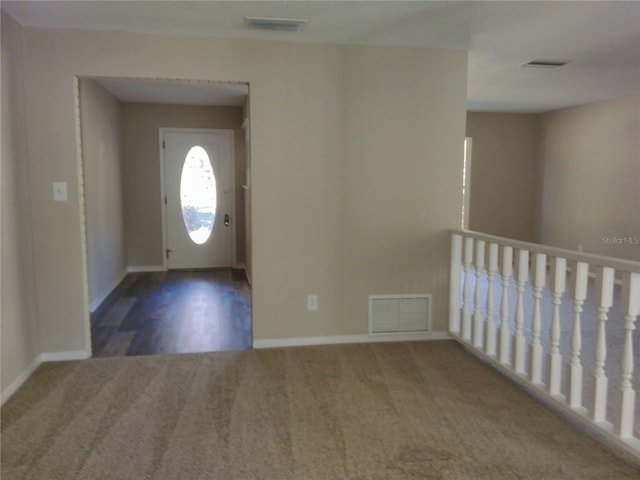 view of carpeted foyer